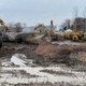 A photo of construction equipment clearing the site of the Ohio derailment.